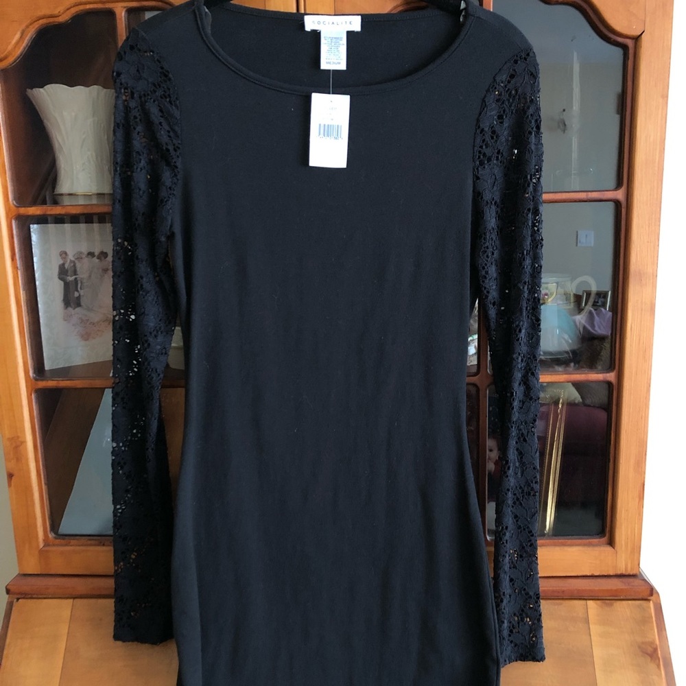 NWT. Body con black dress lace long sleeves.